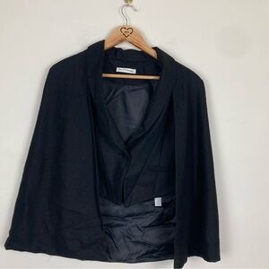 Jus d’orange black wool blend vest with attached cape. Size small.